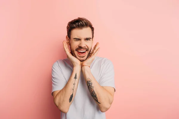 Sly Young Man Hands Face Smiling Winking Pink Background — Stock Photo, Image