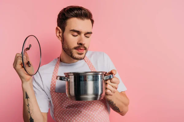 Pleased Young Man Apron Enjoying Flavor Closed Eyes While Opening — Stock Photo, Image