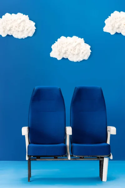 bright and bright seats on blue background with clouds  