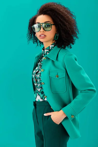 Stylish African American Woman Hand Pocket Looking Camera Isolated Turquoise — Stock Photo, Image