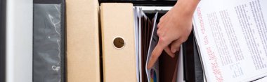 Top view of businesswoman searching documents in cabinet driver with paper folders isolated on white, panoramic shot