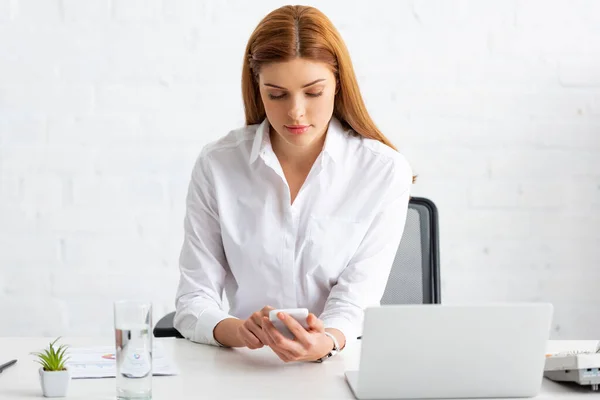 Businesswoman Using Smartphone Document Chart Laptop Table Office — 图库照片