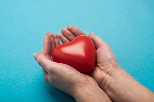 Cropped View Decorative Red Heart Woman Hands Blue Background World — Stock Photo, Image