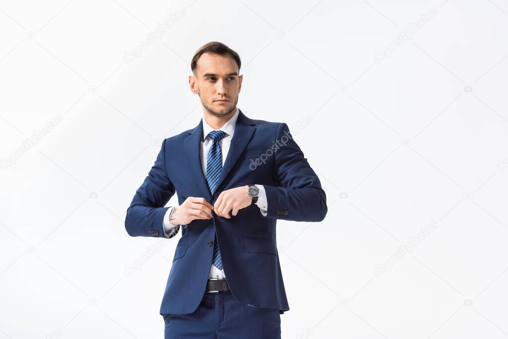 successful young businessman in blue suit isolated on white