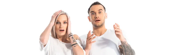 Shocked Young Tattooed Couple Gesturing Isolated White Panoramic Shot — Stock Photo, Image