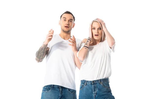 Shocked Young Tattooed Couple Gesturing Isolated White — Stock Photo, Image