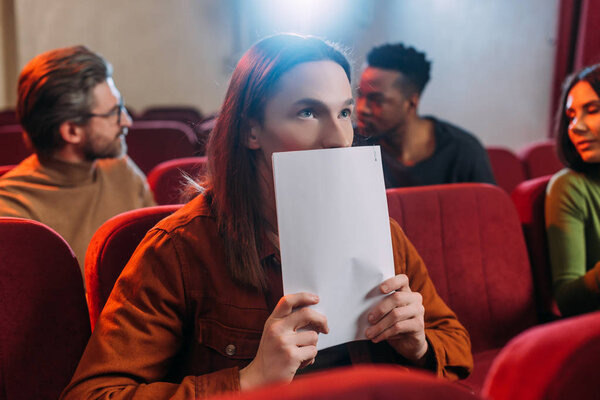 multicultural actors and actress reading scripts in theatre