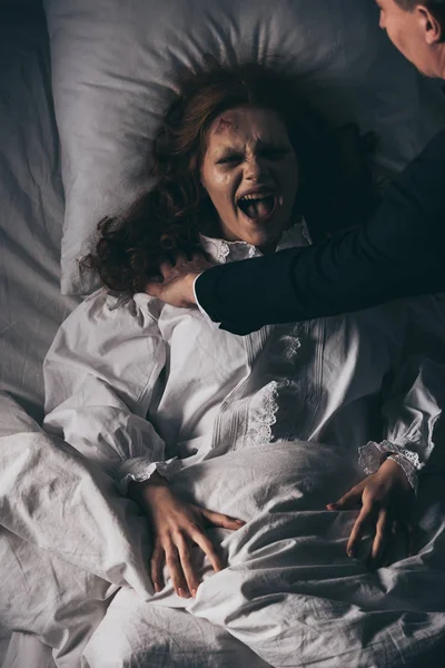 Exorcist Holding Screaming Obsessed Girl Bed — Stock Photo, Image