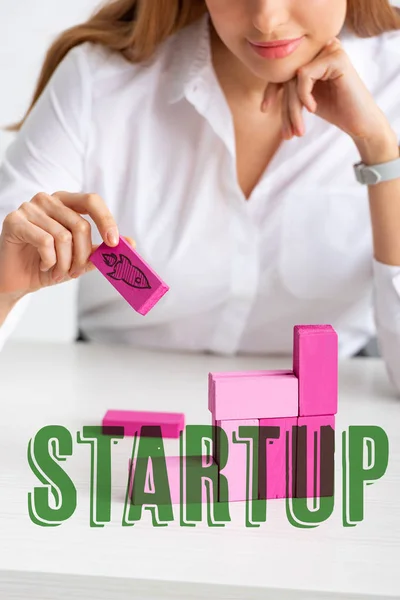 Selective focus of businesswoman stacking marketing pyramid with pink building blocks isolated on grey, startup illustration — Stock Image Selective Focus Businesswoman Stacking Marketing Pyramid Pink Building Blocks Isolated Stock Picture
