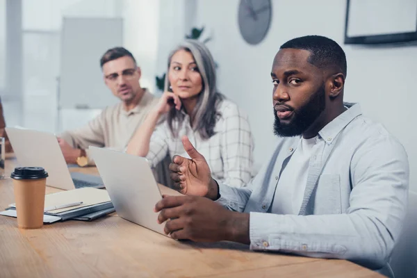 Selective Focus African American Man Looking Camera His Colleagues Looking — Stock Photo, Image