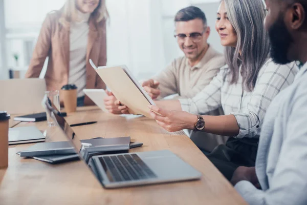 Cropped View Smiling Multicultural Colleagues Looking Folder Meeting — Stock Photo, Image