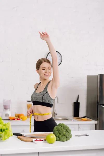 Cheerful Girl Measuring Waist Fresh Food Kitchen — Stock Photo, Image