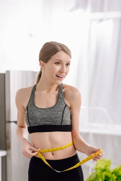 Happy Girl Measuring Waist Fresh Lettuce Kitchen — Stock Photo, Image