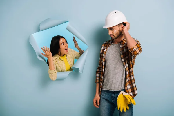 Angry Woman Yelling Confused Workman Helmet Torn Paper Isolated Blue — Stock Photo, Image