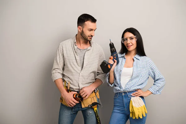 Happy Manual Workers Holding Electric Drill Grey — Stock Photo, Image
