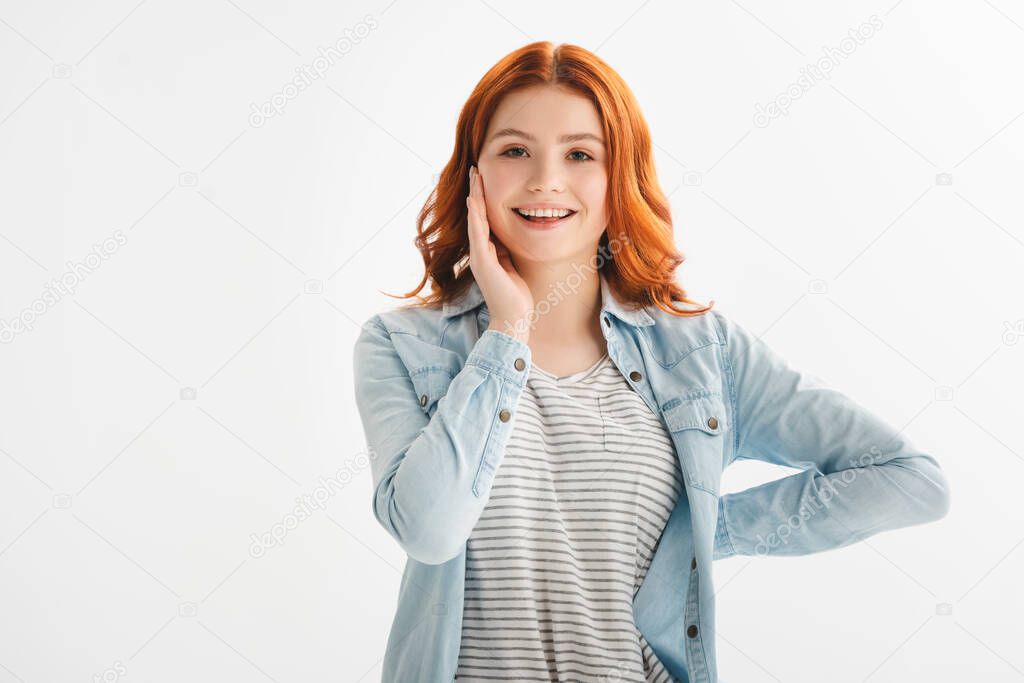 happy redhead teen girl in denim clothes, isolated on white