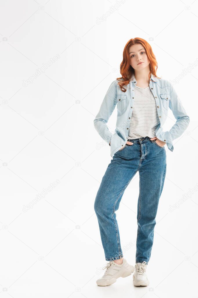 beautiful teen girl with red hair in denim clothes, isolated on white