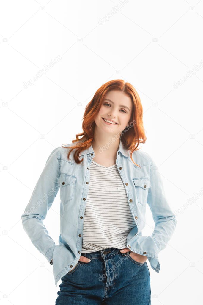 cheerful redhead teen girl in denim clothes, isolated on white