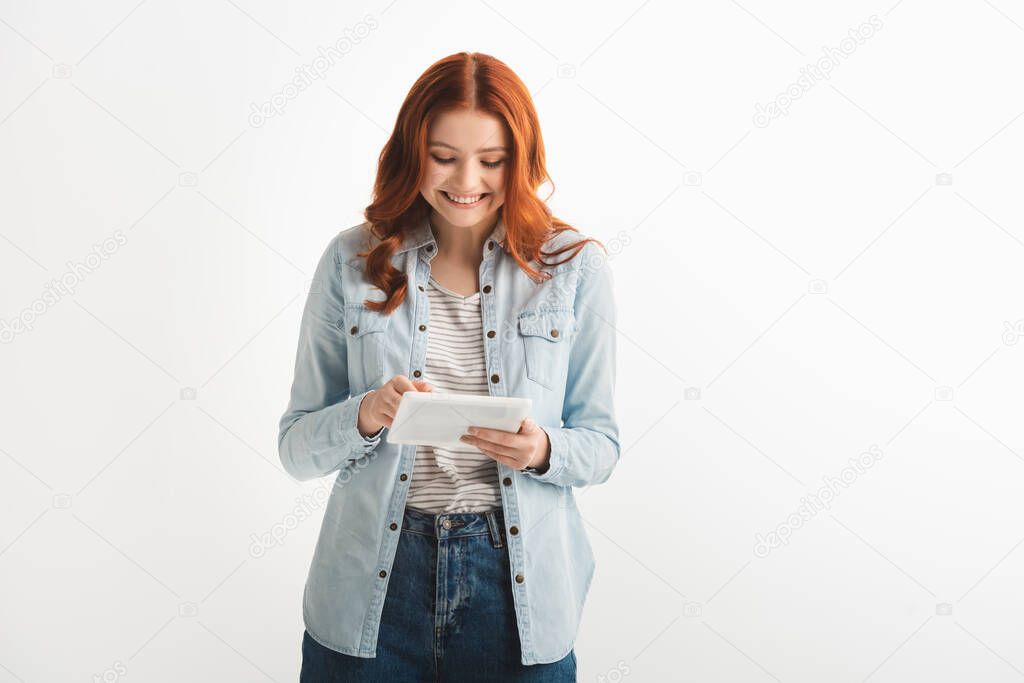 beautiful smiling teenager using digital tablet, isolated on white