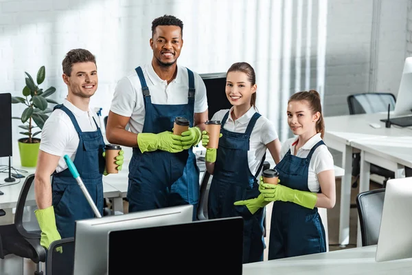 Cheerful Multicultural Cleaners Looking Camera While Holding Coffee Office — Stock Photo, Image