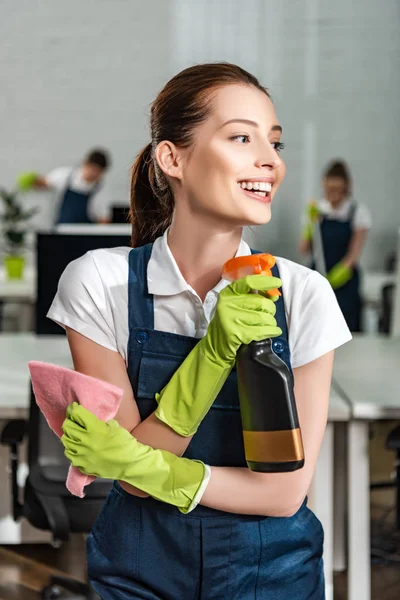 Happy Cleaner Looking Away While Holding Detergent Spray Rag — Stock Photo, Image