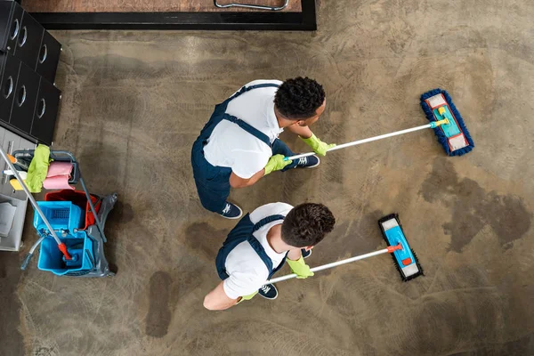 Top View Two Multicultural Cleaners Washing Floor Mops — Stock Photo, Image