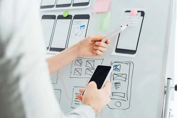 Selective Focus Designers Using Wireframe Layouts Whiteboard Smartphone While Working — Stock Photo, Image