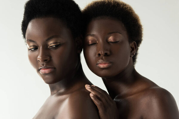 Tender naked african american girls isolated on grey