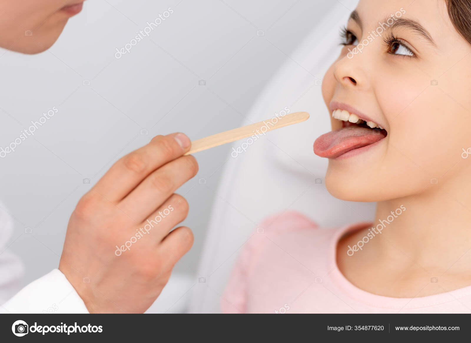 Cropped View Otolaryngologist Holding Tongue Depressor Kid Sticking Out Tongue Stock Photo by