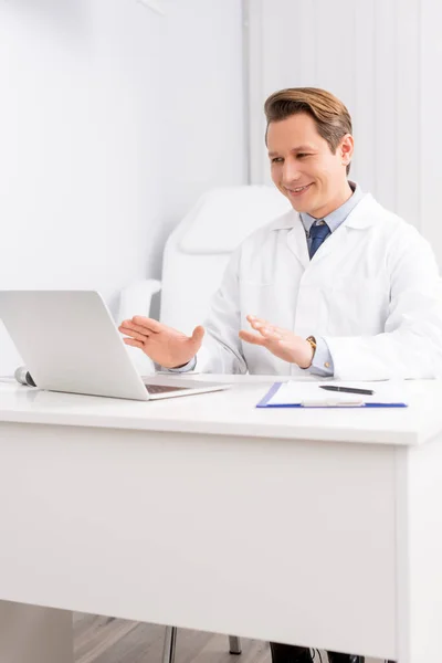 Cheerful Otolaryngologist Having Video Call Laptop While Sitting Workplace — Stock Photo, Image