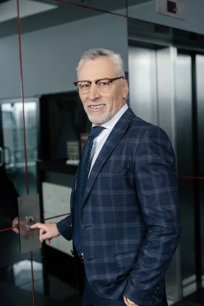 Smiling Businessman Pushing Button Elevator Looking Camera — Stock Photo, Image