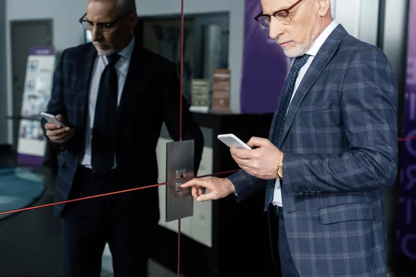 Cropped View Businessman Using Smartphone Pushing Button Elevator — Stock Photo, Image