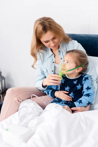 Caring Mother Touching Respiratory Mask Asthmatic Daughter Using Compressor Inhaler — Stock Photo, Image