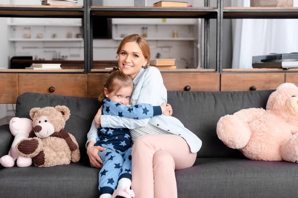 Cute Kid Hugging Mother Soft Toys Sofa — Stock Photo, Image