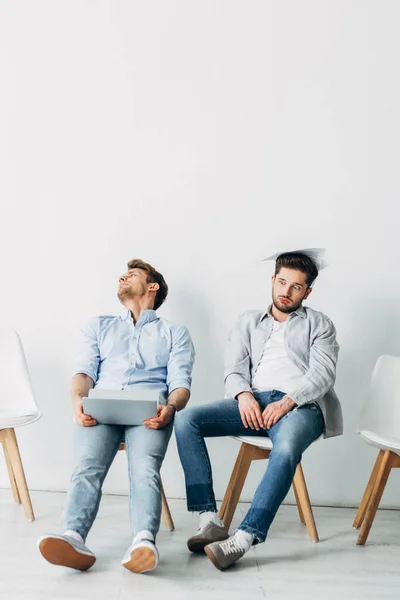 Tired Applicants Resume Laptop Sitting Chairs Office — Stock Photo, Image