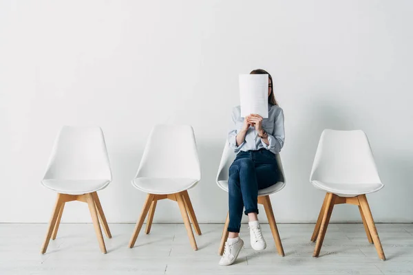 Young Woman Covering Face Resume While Waiting Job Interview Office — Stock Photo, Image