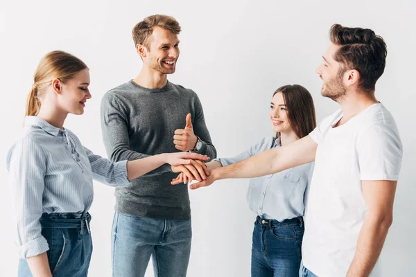 Smiling Man Showing Thumb While Holding Hands Coworkers Office — Stock Photo, Image