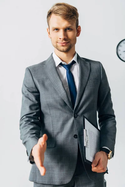 Selective Focus Handsome Man Clipboard Pulling Hand Handshake Looking Camera — Stock Photo, Image