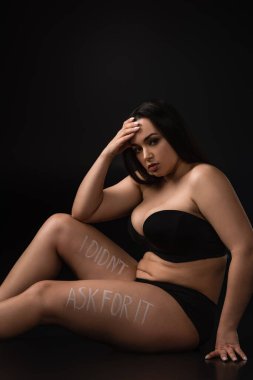 Upset plus size model with lettering I Did not Ask For It on body on black background clipart