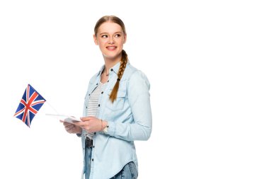 smiling pretty girl with braid holding digital tablet and uk flag isolated on white clipart