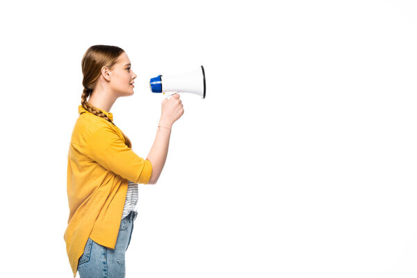 side view of pretty girl with braid talking in loudspeaker isolated on white