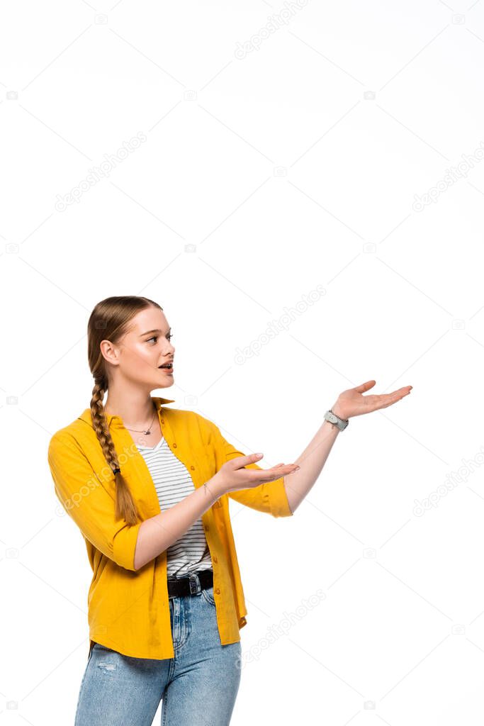 pretty girl with braid pointing with hands aside isolated on white