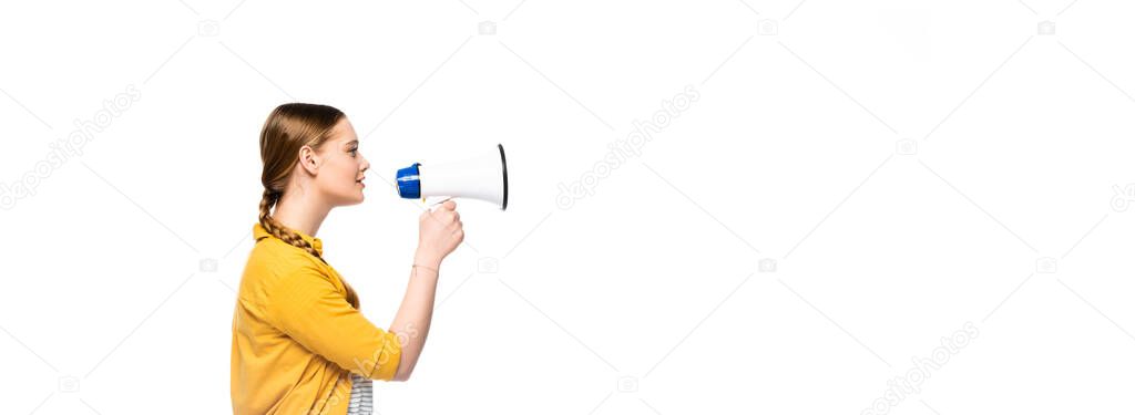 side view of pretty girl with braid talking in loudspeaker isolated on white, panoramic shot