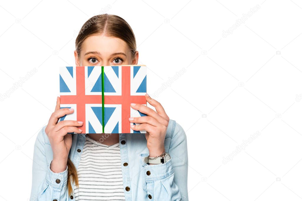 pretty girl with braid and obscure face holding book with uk flag isolated on white