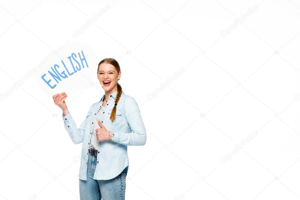 smiling girl with braid holding speech bubble with English lettering and showing thumb up isolated on white