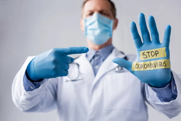 Selective Focus Middle Aged Doctor Medical Mask Pointing Finger Hand — Stock Photo, Image