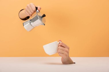 cropped view of woman holding coffee pot near cup on orange and white  clipart