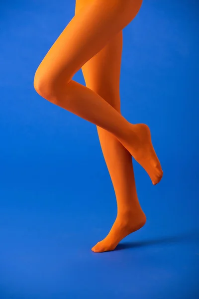 Cropped View Woman Bright Orange Tights Posing Blue — Stock Photo, Image