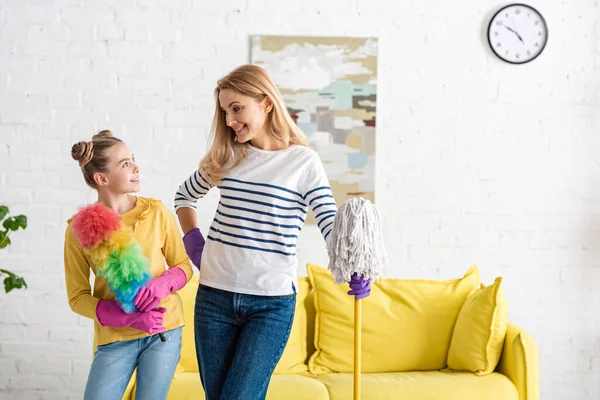 Mother Cute Daughter Feather Duster Mop Smiling Looking Each Other — Stock Photo, Image