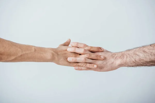 Widok Mężczyzn Trzymających Się Ręce Odizolowanych Szaro — Zdjęcie stockowe